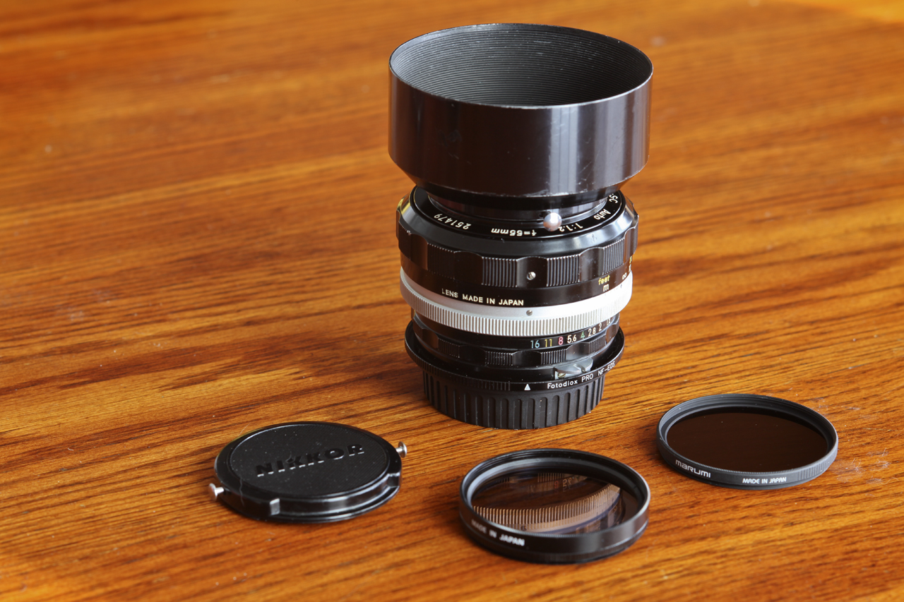 Nikkor-SC Auto 1:1.2 55mm with lens cap, hood, ND8 and Circular Polarizer