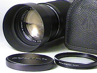 Lens, hood, caps, case and attachment lens (not shown)